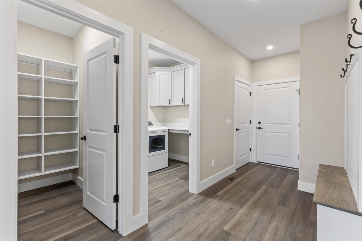 Functional laundry room and storage shelves in a custom home in Knoxville, TN by Debuty Builders, Inc.