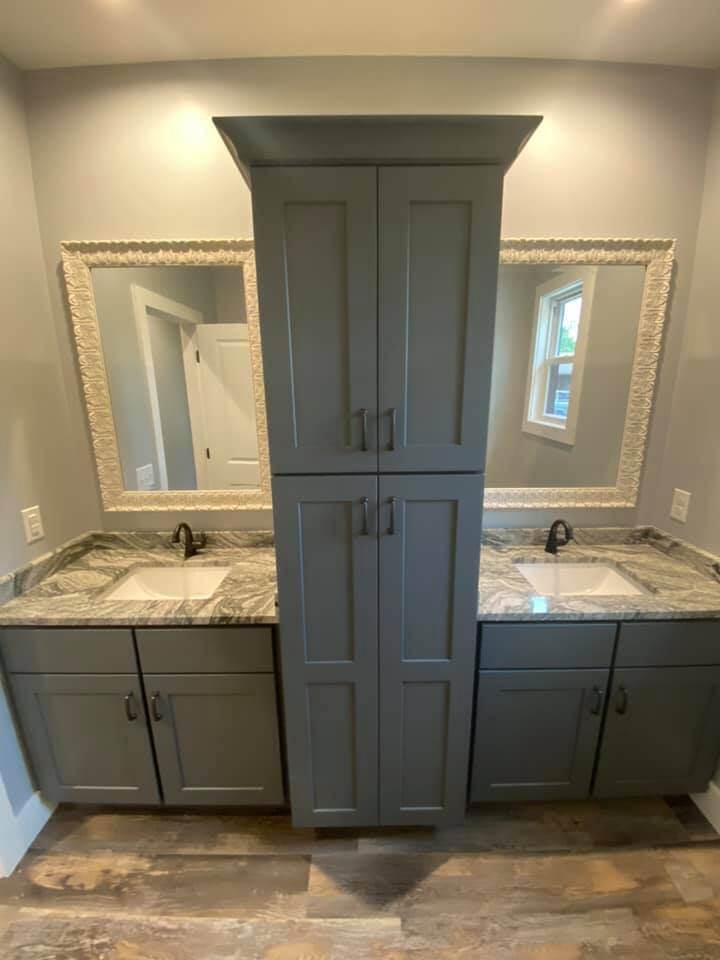 Double vanity with granite countertops and large storage cabinet in custom home by Debuty Builders, Knoxville, TN