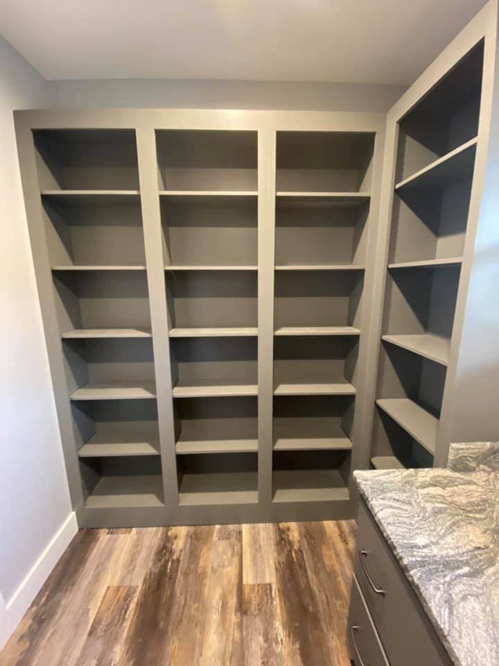 Walk-in closet with custom gray shelving in Debuty Builders custom home, Knoxville, TN