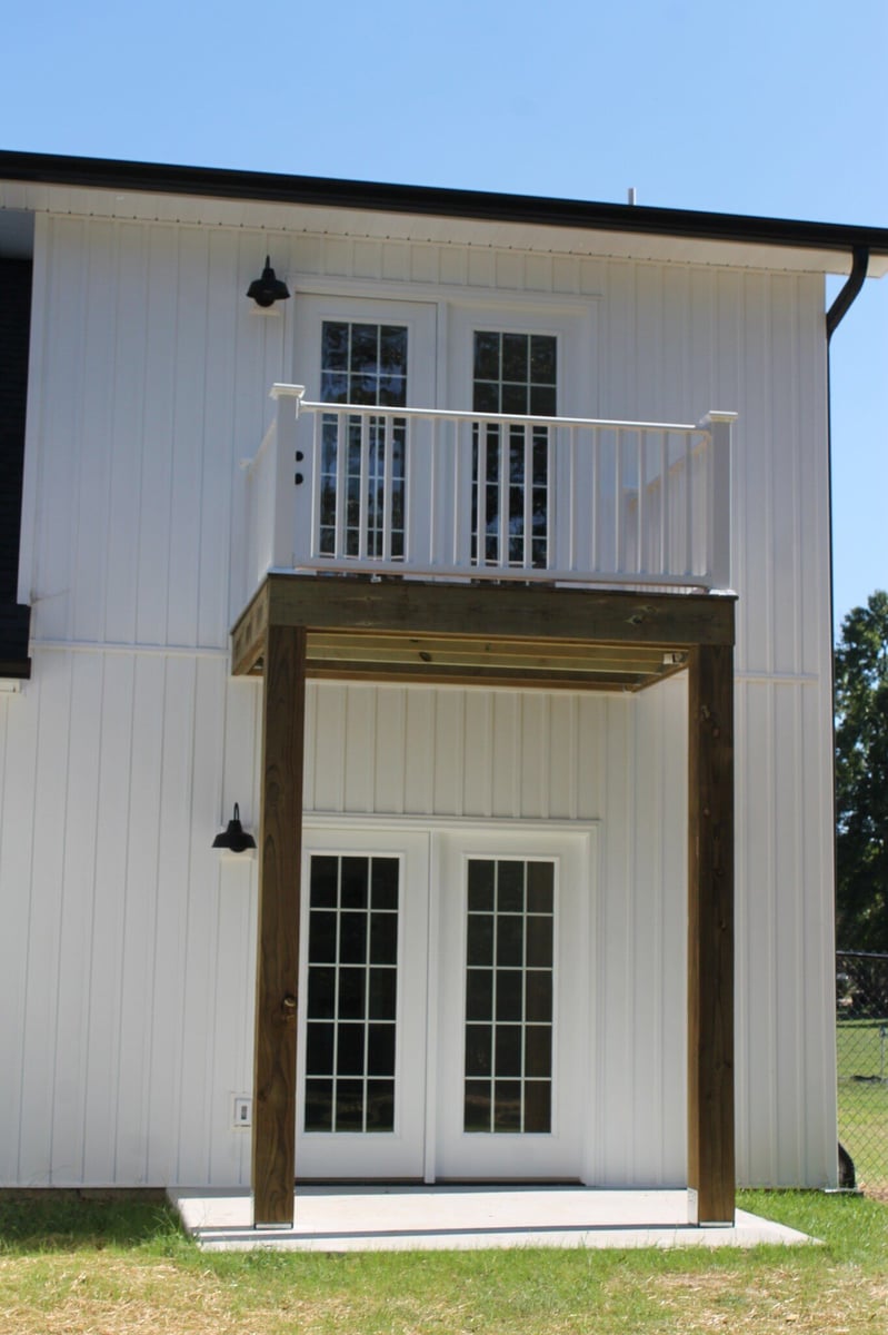 Small balcony with white railing on a custom home built by Debuty Builders, Knoxville, TN