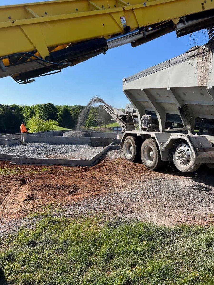 Concrete being poured at a custom home construction site in Knoxville, TN by Debuty Builders