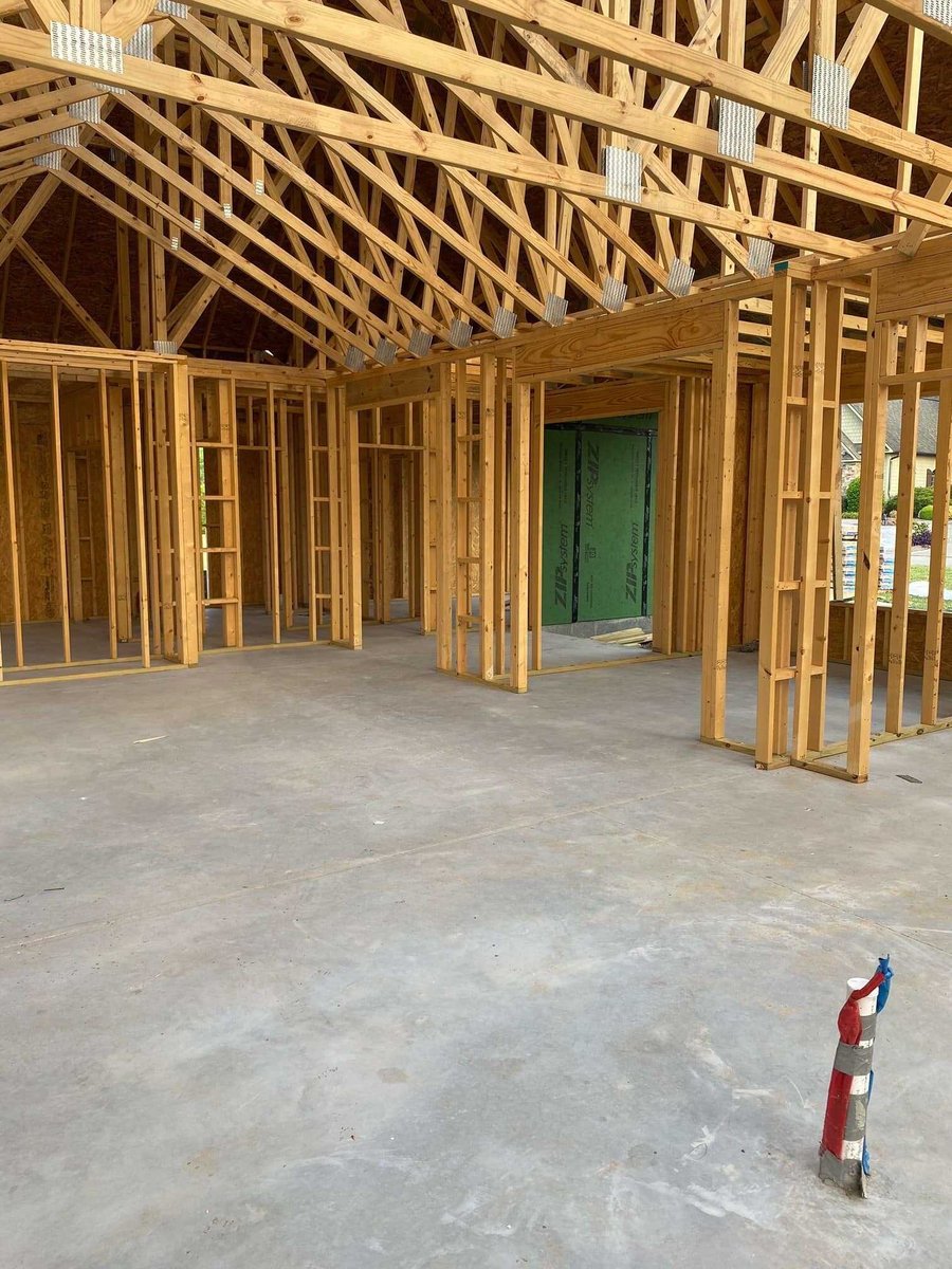 Wooden framing of a new custom home interior in Knoxville, TN by Debuty Builder