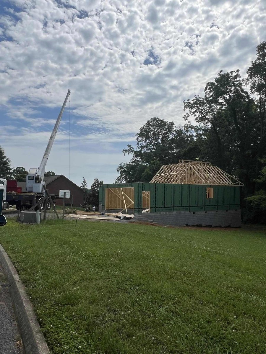 Framing of a custom home exterior with crane in operation by Debuty Builders in Knoxville, TN