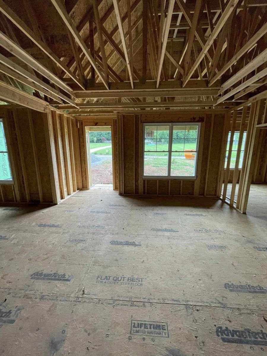 Interior view of framed walls and open windows in a custom home by Debuty Builders, Knoxville, TN