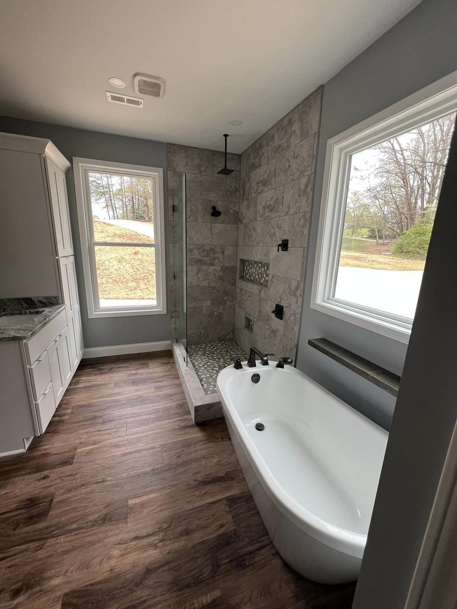 Spacious modern bathroom with large tub and glass shower enclosure, Debuty Builders, Knoxville, TN