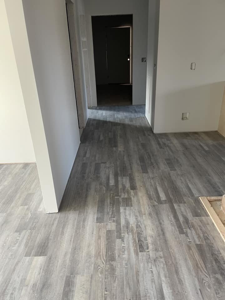 Hallway featuring new flooring in custom home by Debuty Builders, Knoxville, TN