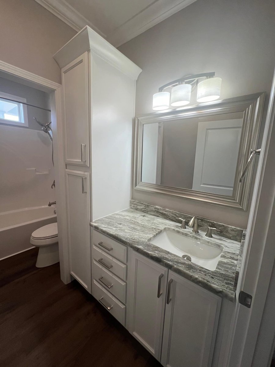 Custom bathroom vanity with marble countertops by Debuty Builders in Knoxville, TN
