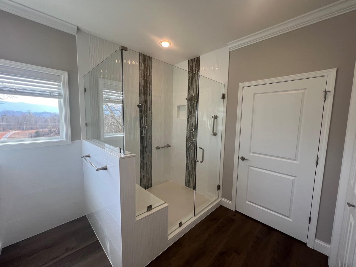 Custom walk-in shower with large tiles and glass enclosure by Debuty Builders, Knoxville, TN