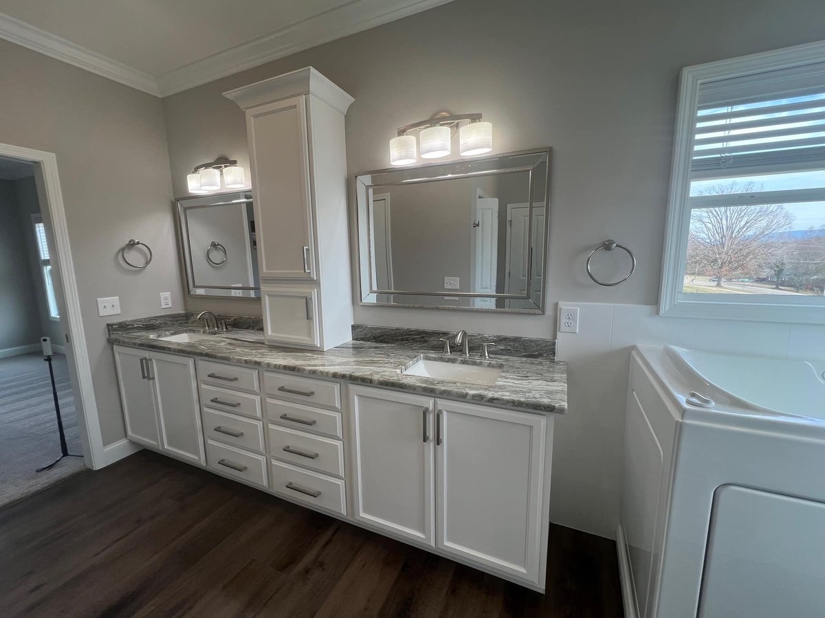 Double sink bathroom vanity with marble countertops in a Debuty Builders custom home, Knoxville, TN