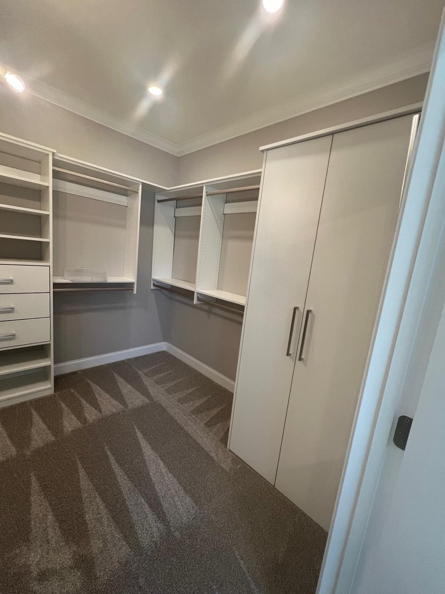 Spacious walk-in closet with built-in shelving in a custom home by Debuty Builders, Knoxville, TN