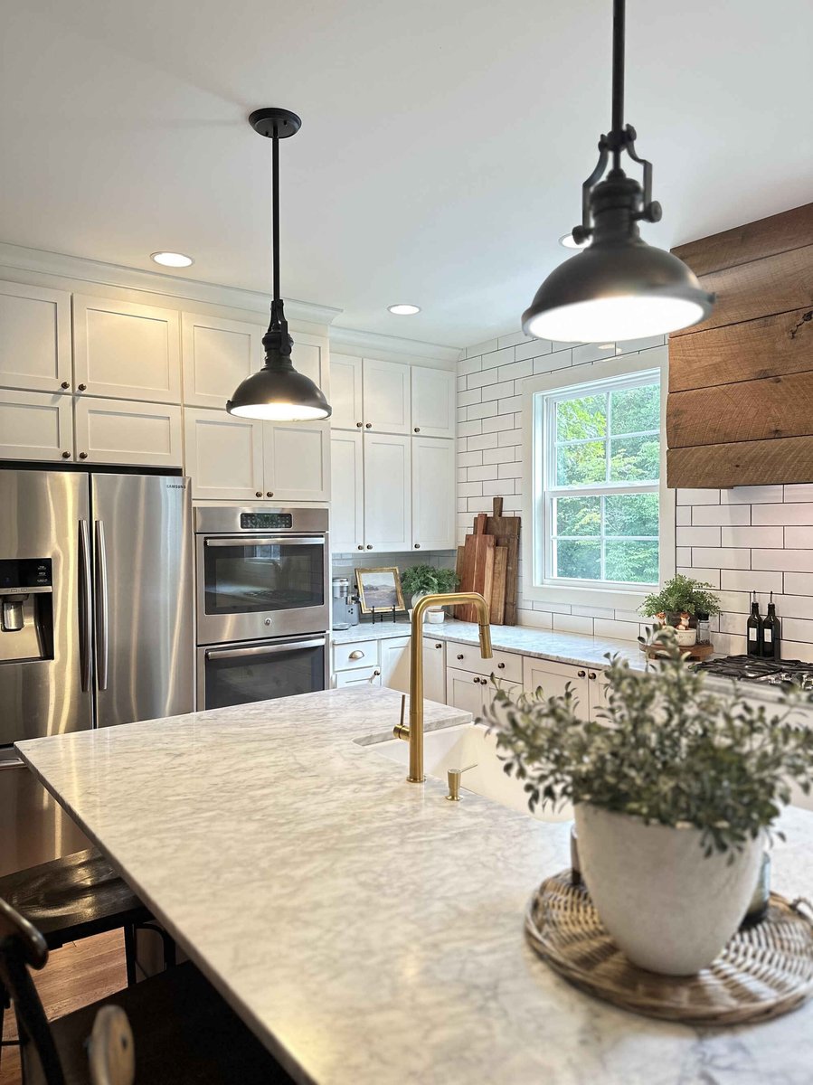 Bright kitchen with farmhouse sink and modern fixtures in a custom home by Debuty Builders, Knoxville, TN