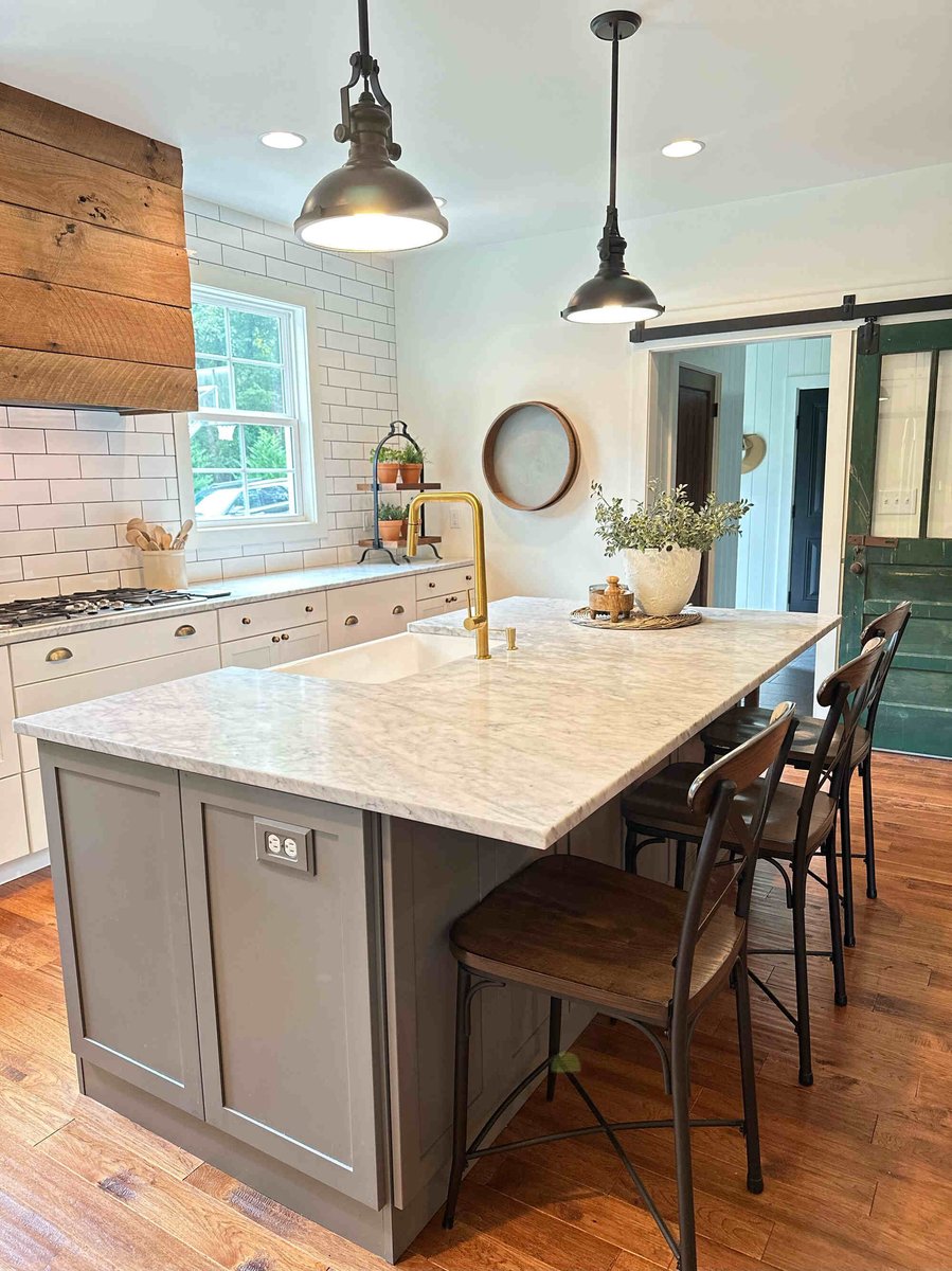 Kitchen island with marble countertop and farmhouse sink in a custom home by Debuty Builders, Knoxville, TN