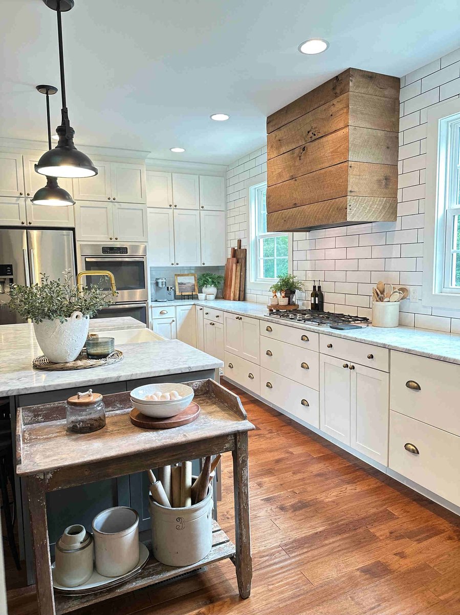 Rustic modern kitchen with wooden hood and marble countertops by Debuty Builders, Knoxville, TN