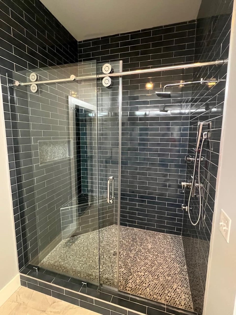 Sleek black-tiled shower installation in a custom home by Debuty Builders, Knoxville, TN