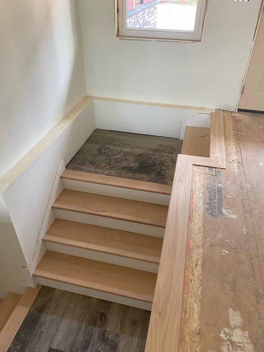 Wooden staircase under construction at a custom home by Debuty Builders in Knoxville, TN