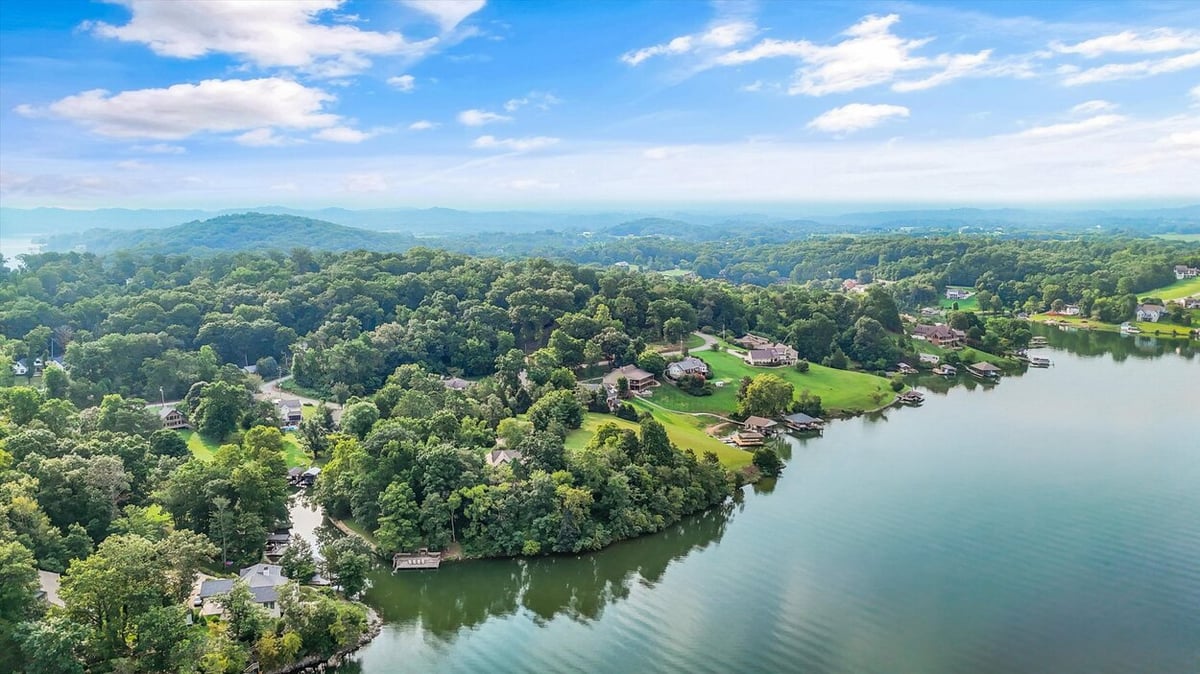 Expansive aerial of lake and surrounding forested area near Friendsville Custom Home in Knoxville, TN