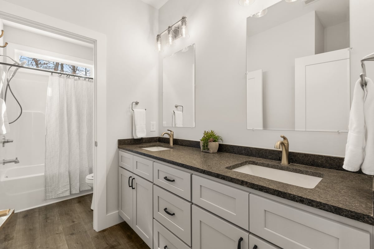 Bathroom with double vanity and shower in Vonore custom home in Knoxville, TN