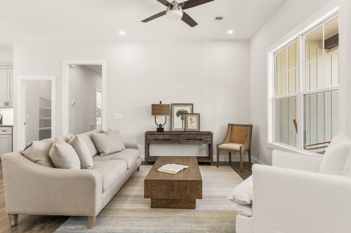 Bright living room with neutral furnishings in Vonore custom home in Knoxville, TN