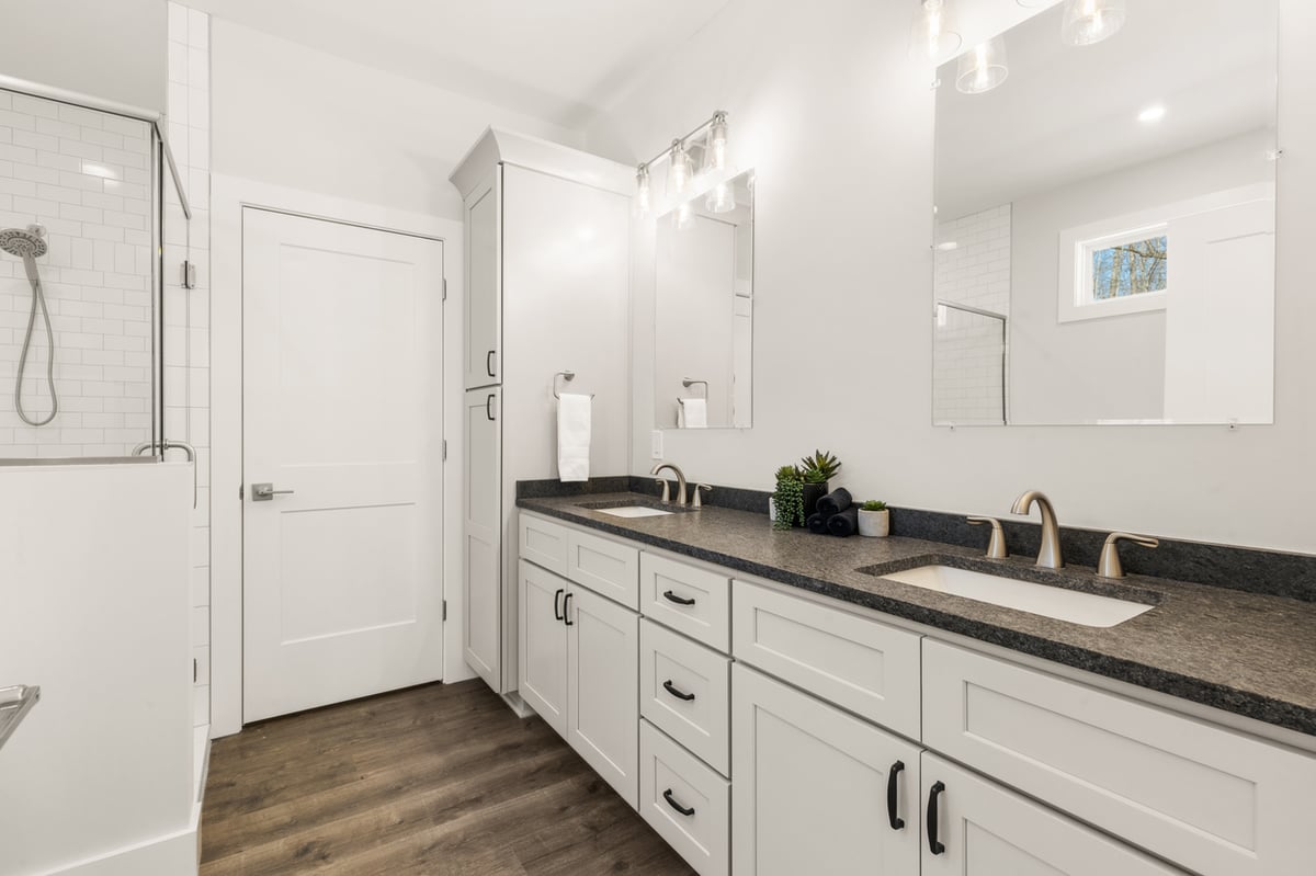 Double vanity bathroom with white cabinetry in Vonore custom home in Knoxville, TN