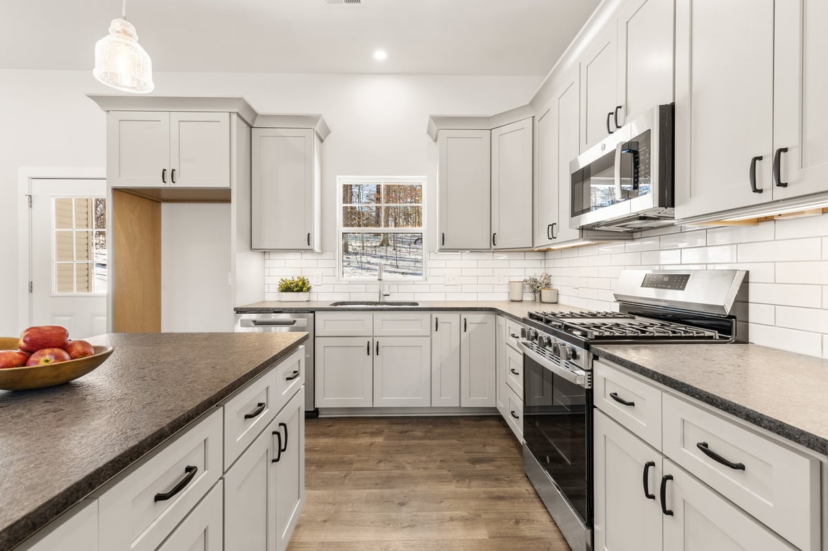 Quartz countertop island in modern kitchen of Vonore custom home in Knoxville, TN