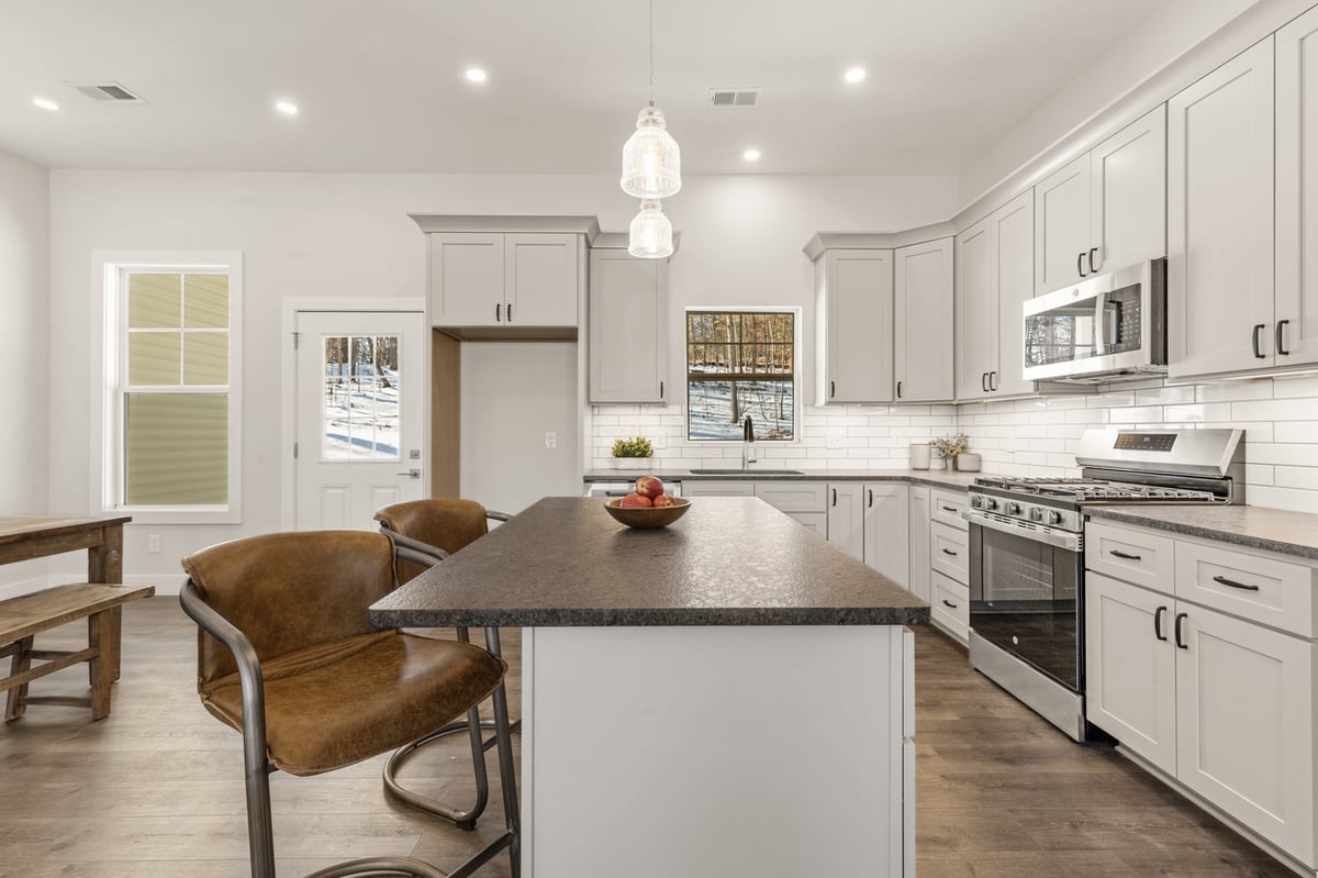 White cabinetry and stainless steel appliances in Vonore custom home in Knoxville, TN